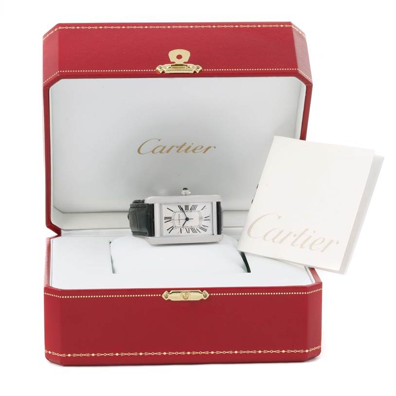 The Cartier Tank Americaine W2603256 Men's White Gold Silver Dial W2603256 Men's White Gold Silver Dial watch is displayed in its open red box, showing the dial and black leather strap, with accompanying booklet.