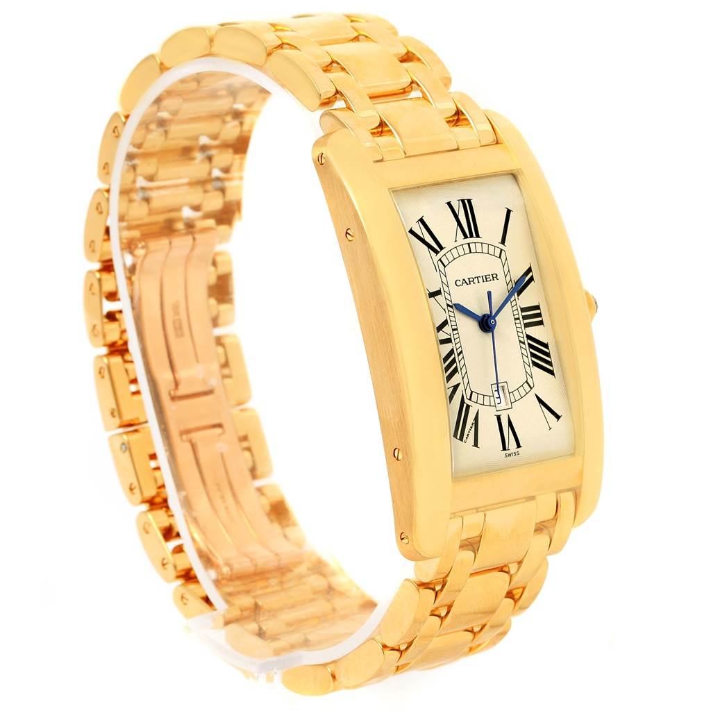 The image shows a Cartier Tank Americaine W26031K2 Men
s Yellow Gold Silver Dial W26031K2 Men
s Yellow Gold Silver Dial watch at a slight angle, highlighting the face, bracelet, and clasp.