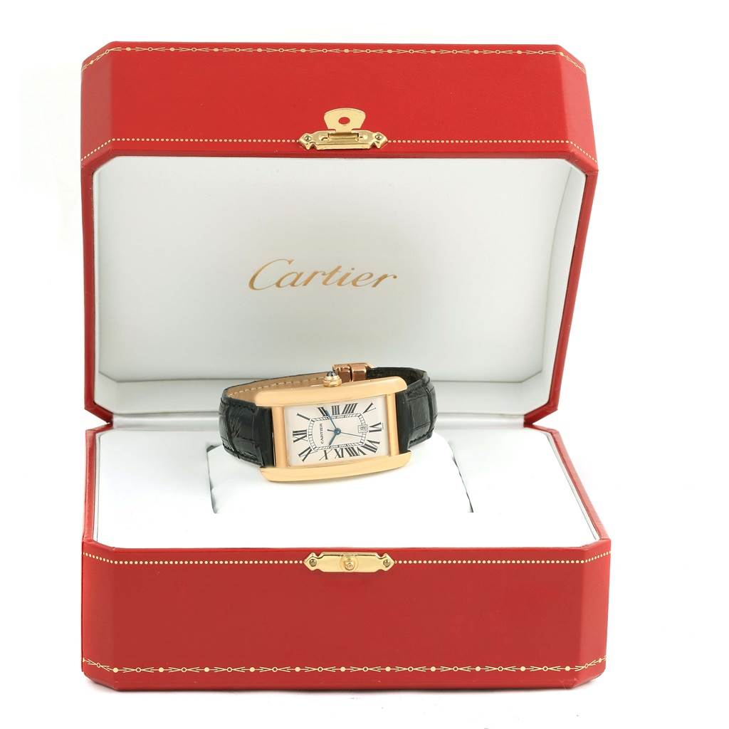The Cartier Tank Americaine W2603156 Men's Yellow Gold Silver Dial W2603156 Men's Yellow Gold Silver Dial watch is displayed at a front angle in its open red and white box.