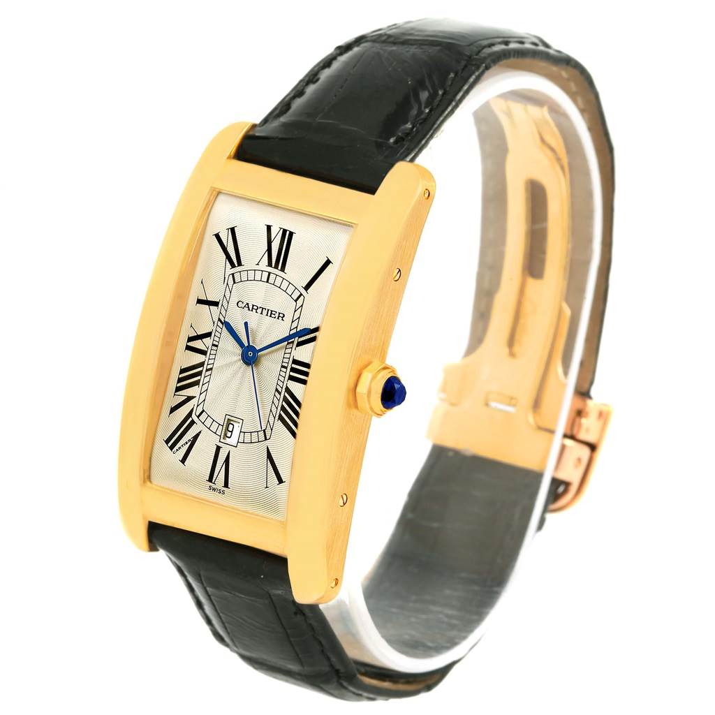 The Cartier Tank Americaine W2603156 Men's Yellow Gold Silver Dial W2603156 Men's Yellow Gold Silver Dial watch is shown at a three-quarter angle, highlighting its rectangular case, dial, and black leather strap.