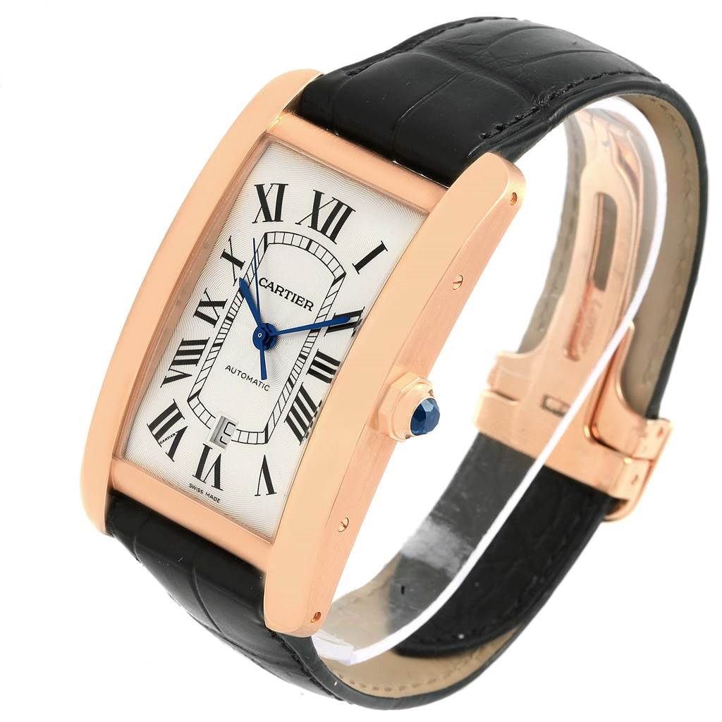 The image shows a Cartier Tank Américaine watch from an angled side view, highlighting its rose gold case and black leather strap.
