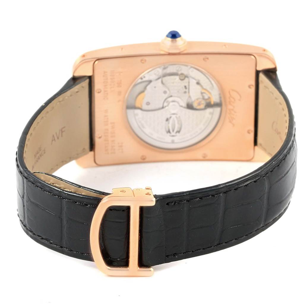 This image shows the back view of a Cartier Tank Americaine W2609856 Men's Rose Gold Silver Dial W2609856 Men's Rose Gold Silver Dial watch, highlighting its black leather strap and caseback mechanism.