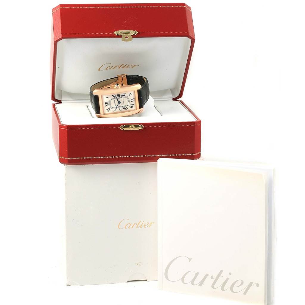 The Cartier Tank Americaine W2609856 Men's Rose Gold Silver Dial W2609856 Men's Rose Gold Silver Dial watch is shown inside its open red display box, with the brand name visible on white packaging.