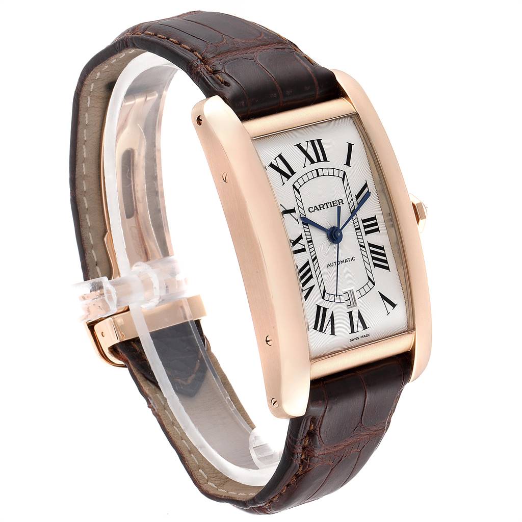 The Tank Americaine model by Cartier is shown at a slight angle, displaying the face, bezel, crown, and leather strap.