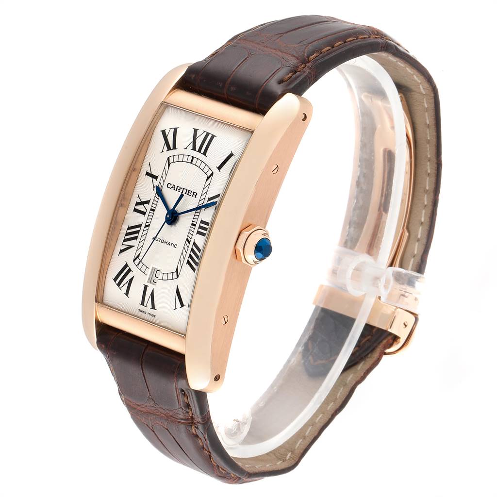 The Cartier Tank Americaine W2609856 Men's Rose Gold Silver Dial W2609856 Men's Rose Gold Silver Dial watch is shown at a three-quarter angle highlighting its rectangular face, blue hands, and leather strap.