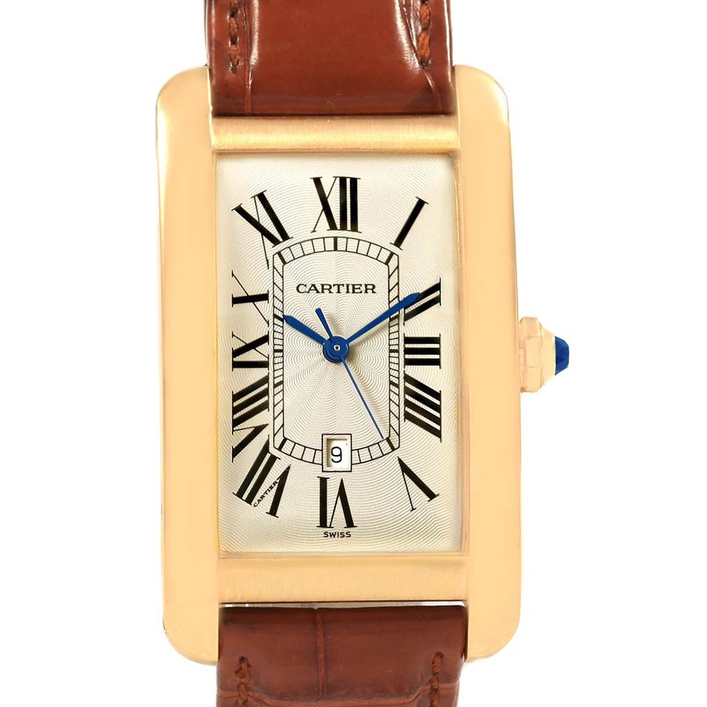 The Tank Americaine model by Cartier is shown from the front, displaying the face, bezel, crown, and part of the leather strap.