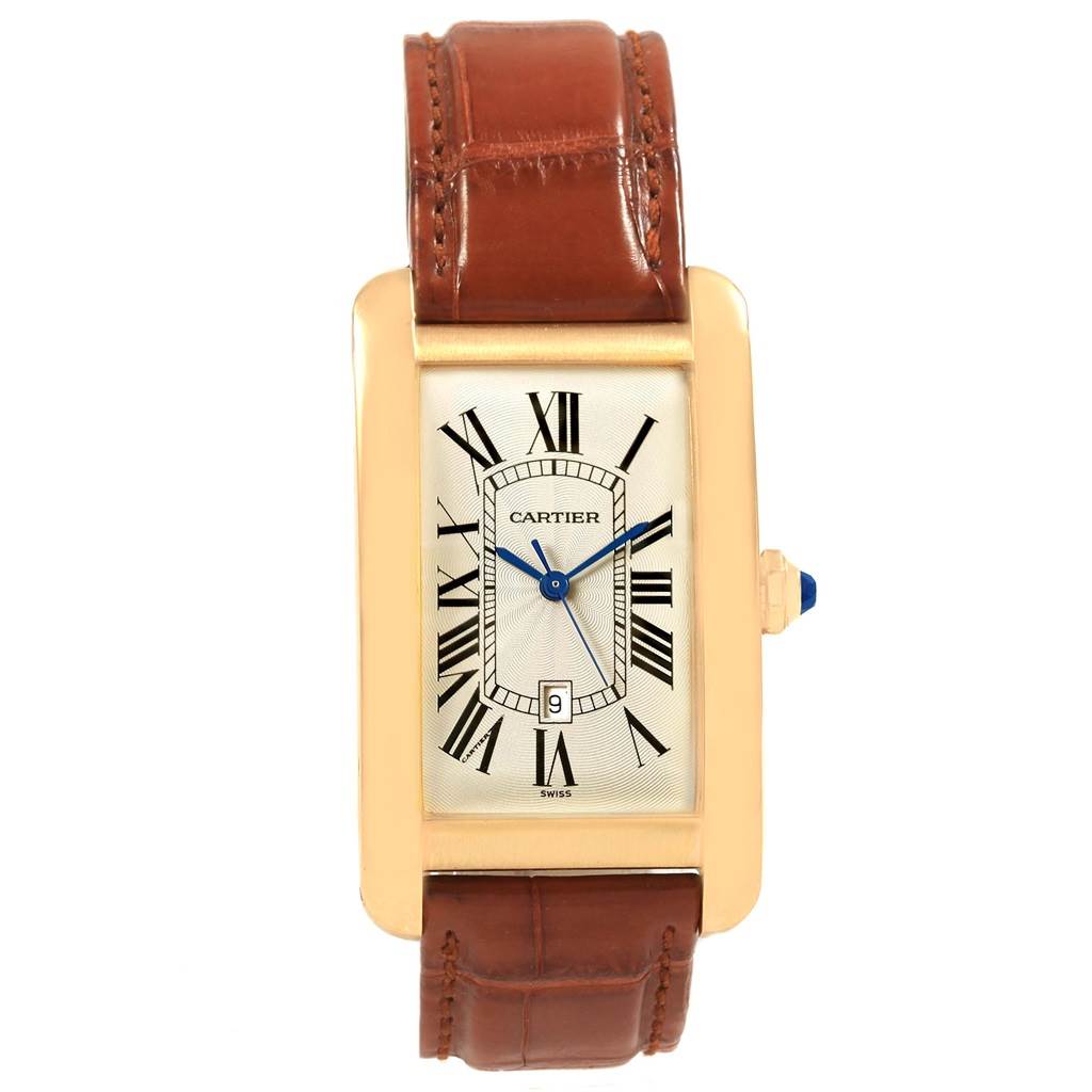 This image shows a frontal view of a Cartier Tank Americaine W2603156 Men's Yellow Gold Silver Dial W2603156 Men's Yellow Gold Silver Dial watch with a leather strap and Roman numeral dial.
