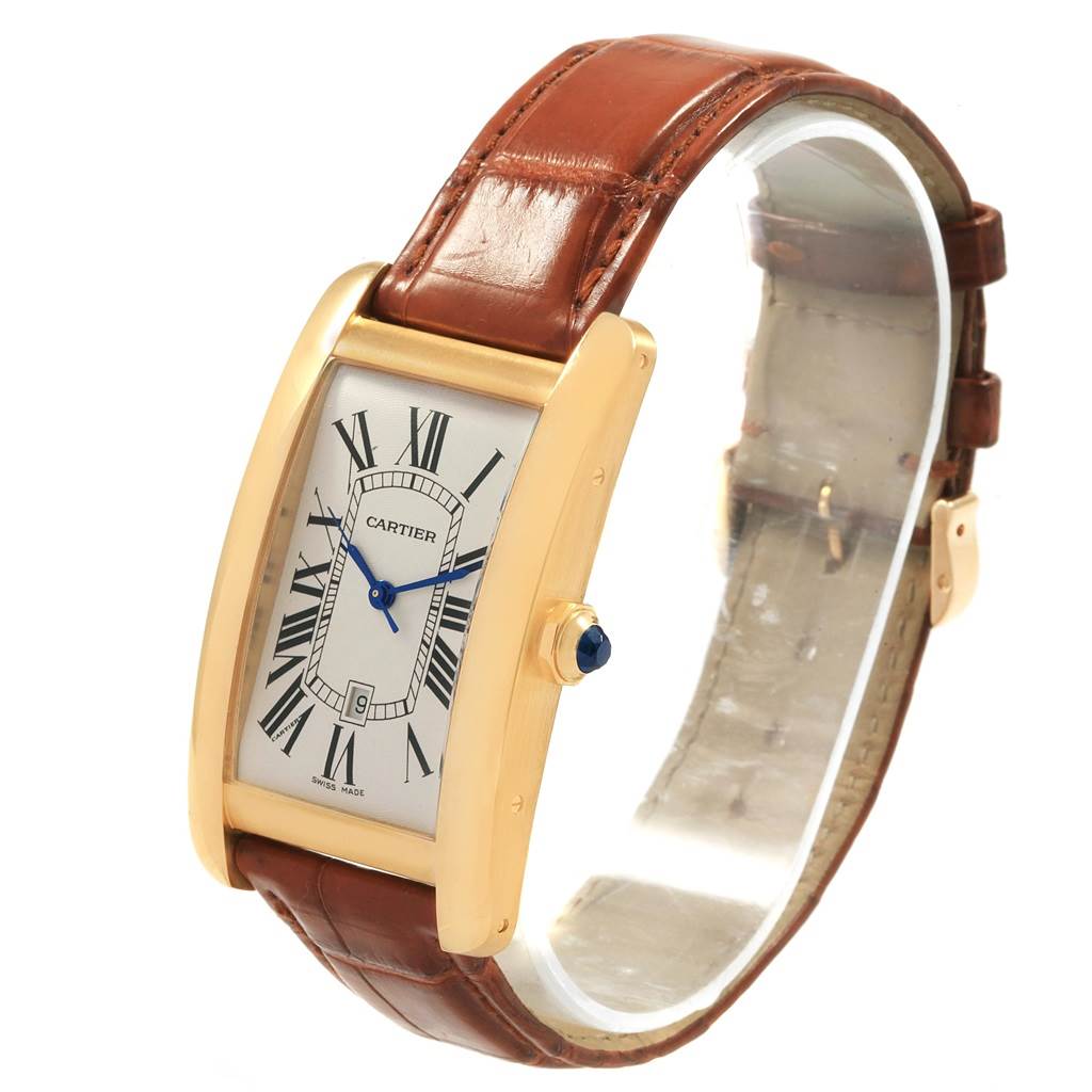 The image shows a Tank Américaine model by Cartier from a three-quarter angle highlighting the face, crown, and leather strap.