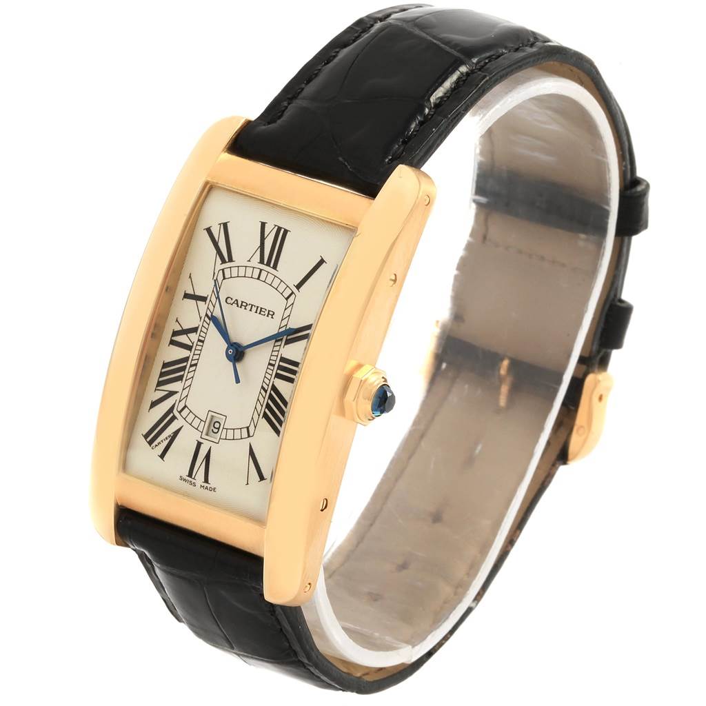 This image shows a Cartier Tank Americaine W2603156 Men's Yellow Gold Silver Dial W2603156 Men's Yellow Gold Silver Dial watch from a three-quarter angle, highlighting the dial, case, and black leather strap.