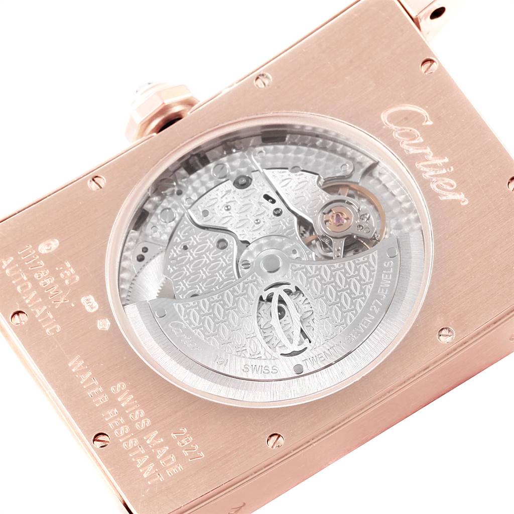 This image shows the back view of the Cartier Tank Americaine W2609856 Men's Rose Gold Silver Dial W2609856 Men's Rose Gold Silver Dial watch, highlighting its intricate automatic movement and engravings.
