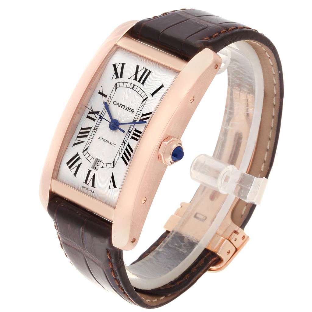 The Cartier Tank Americaine W2609856 Men's Rose Gold Silver Dial W2609856 Men's Rose Gold Silver Dial watch is shown at a slight angle, highlighting the face, blue hands, crown, and leather strap.