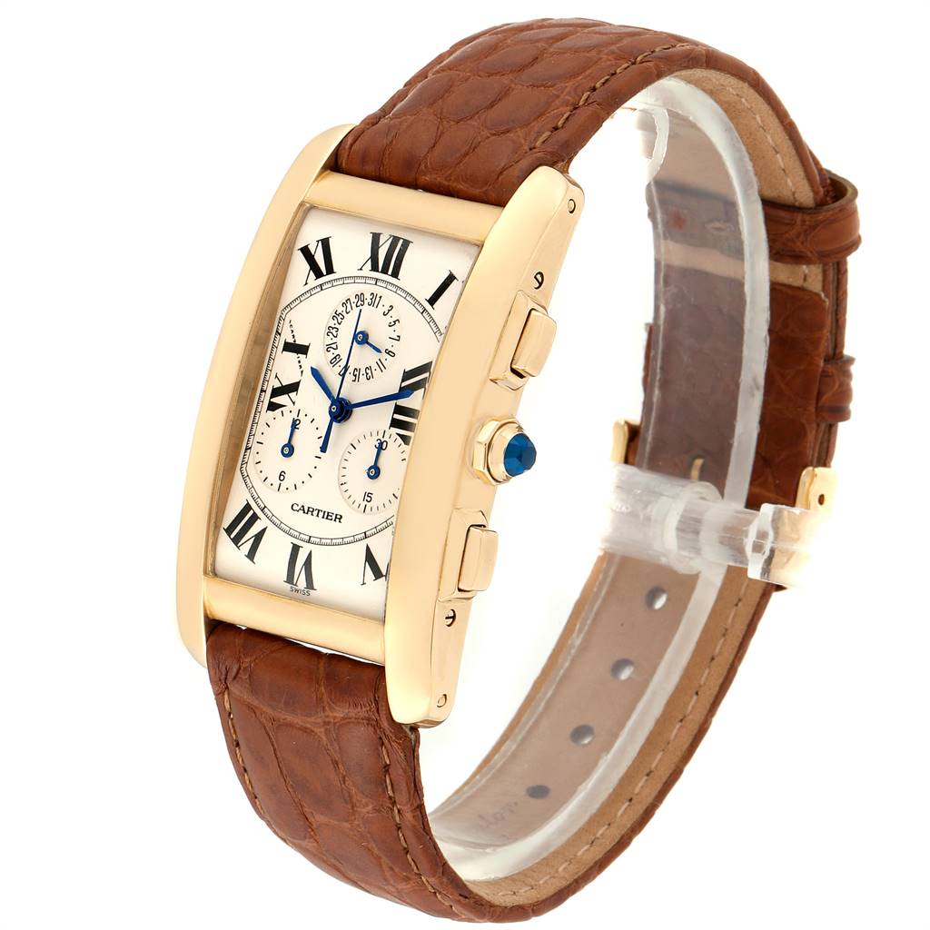 The Cartier Tank Americaine W2601156 Men's Yellow Gold Silver Dial W2601156 Men's Yellow Gold Silver Dial watch is shown at a three-quarter angle, displaying its face, leather strap, and side buttons.