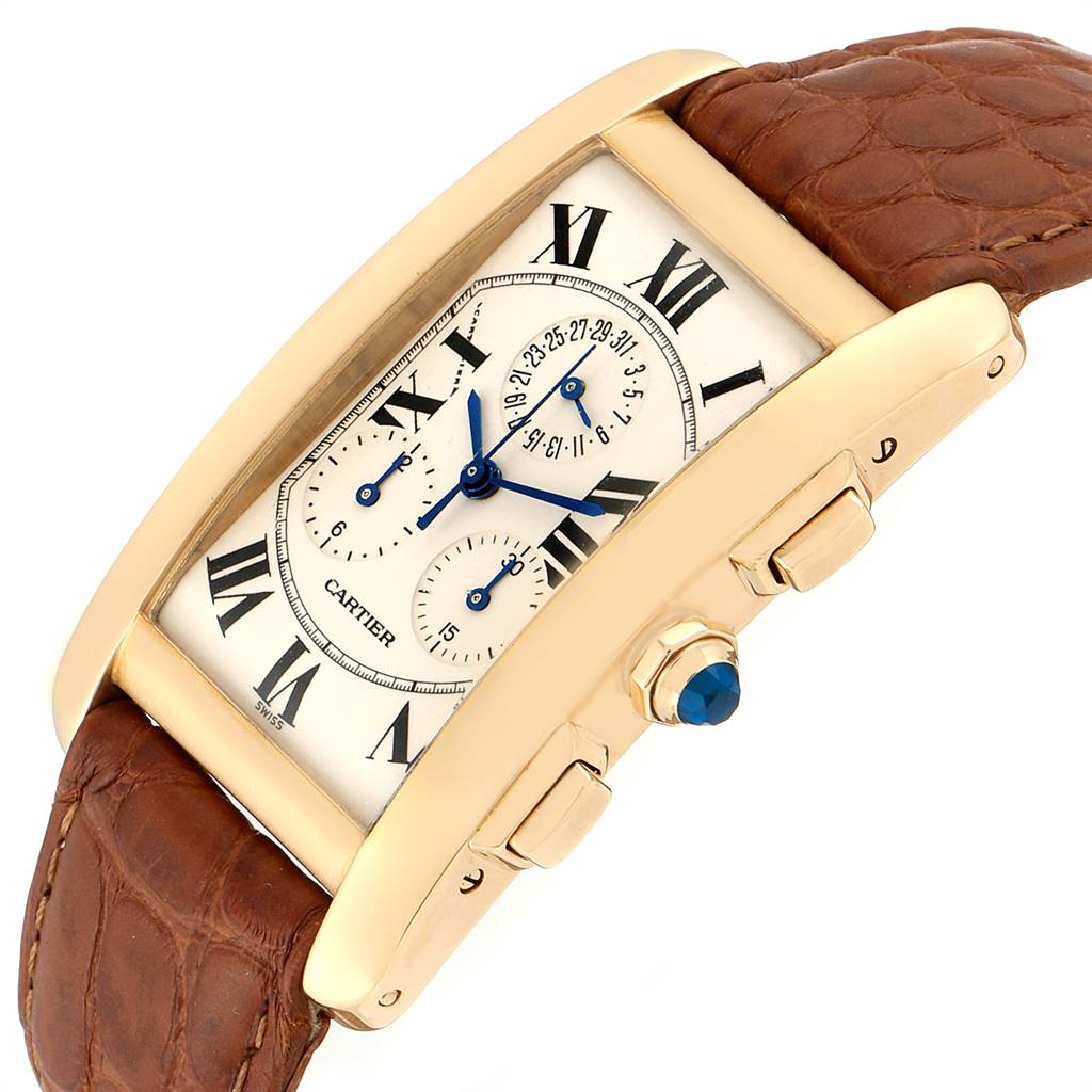 The image shows a side-angle view of the Cartier Tank Americaine W2601156 Men's Yellow Gold Silver Dial W2601156 Men's Yellow Gold Silver Dial watch with a brown leather strap and a detailed dial.