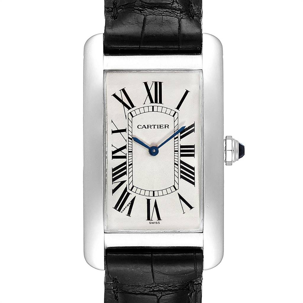 The image shows a front view of the Cartier Tank Americaine W2604351 Men's Platinum Silver Dial W2604351 Men's Platinum Silver Dial watch, featuring its rectangular face, Roman numerals, and a black leather strap.