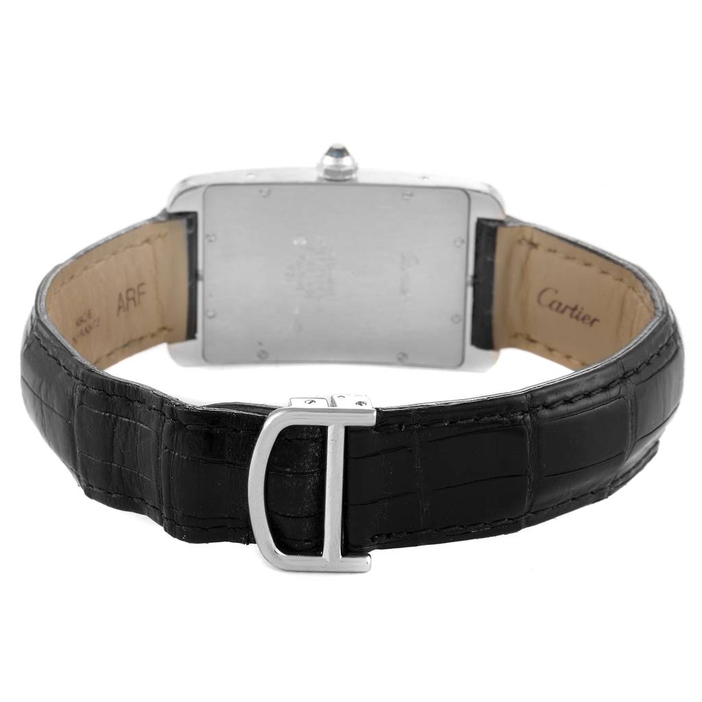This image shows the back view of the Tank Americaine watch by Cartier, including its black leather strap and metal clasp.