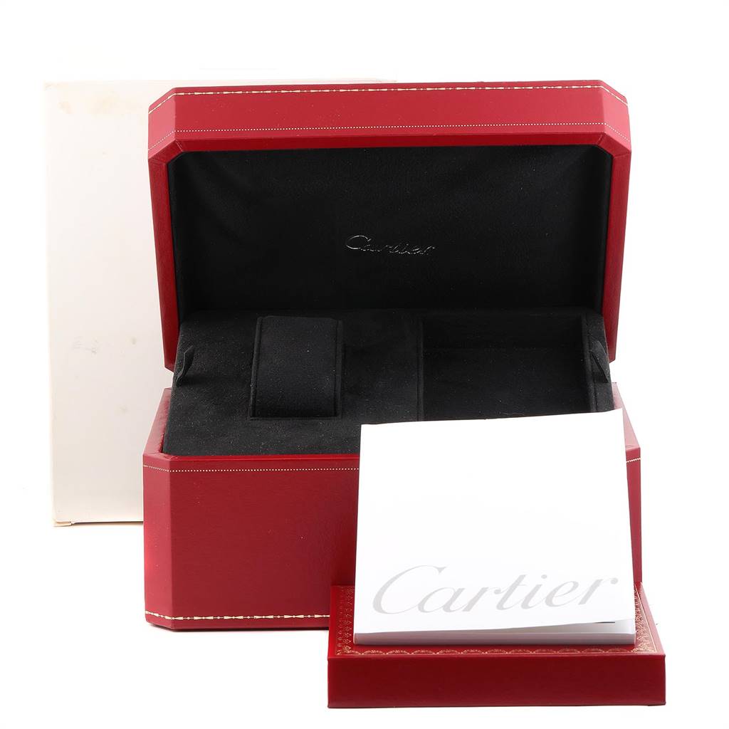 The image shows an open watch box and a booklet for the Cartier Tank Américaine model.