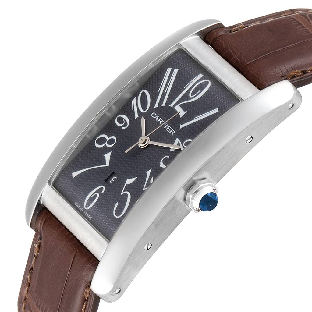 The Cartier Tank Americaine W2605229 Men
s White Gold Grey Dial W2605229 Men
s White Gold Grey Dial watch is shown at an angled close-up, highlighting its dial, case, and crown with a blue cabochon.