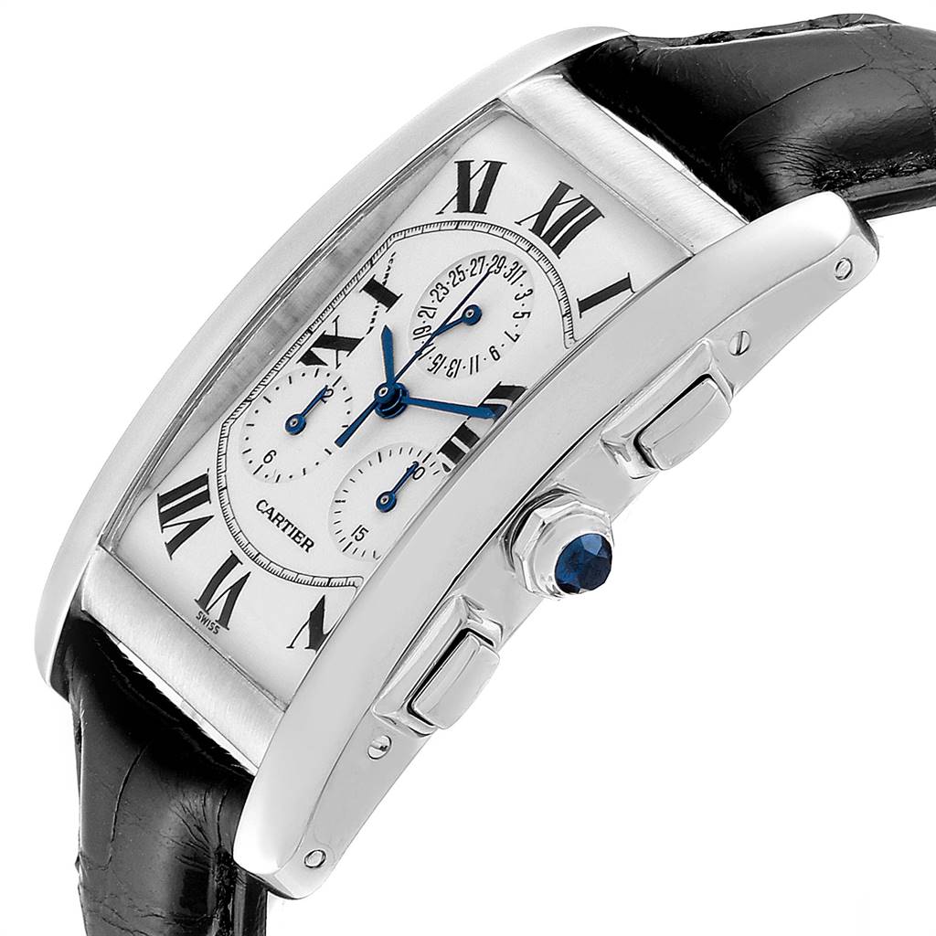 The image shows a side angle of the Cartier Tank Americaine W2603358 Men's White Gold Silver Dial W2603358 Men's White Gold Silver Dial watch, highlighting its crown with a blue sapphire and pushers.