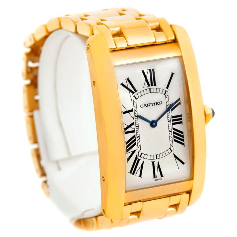 The watch, a Cartier Tank Americaine 1735 Men
s Yellow Gold Silver Dial 1735 Men
s Yellow Gold Silver Dial model, is shown from an angled view displaying the face, bezel, and part of the bracelet.