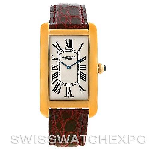 This image shows a frontal view of the Cartier Tank Americaine Yellow Gold Silver Dial Yellow Gold Silver Dial watch, featuring the face, roman numeral markers, and leather strap.
