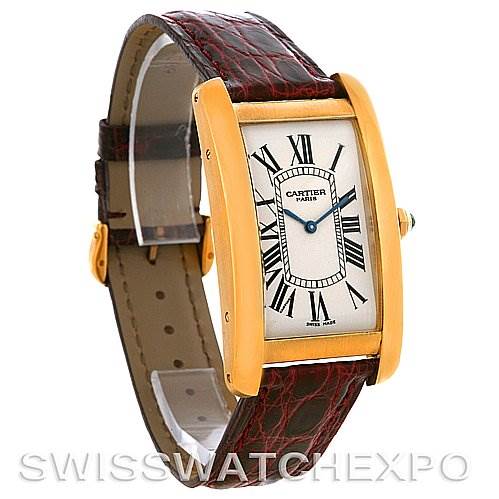 The image shows a frontal view of a Cartier Tank Americaine Yellow Gold Silver Dial Yellow Gold Silver Dial watch, highlighting its face, strap, and side profile.