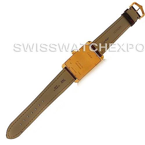 The image shows the back of the Cartier Tank Americaine Yellow Gold Silver Dial Yellow Gold Silver Dial watch, highlighting the strap and case back.