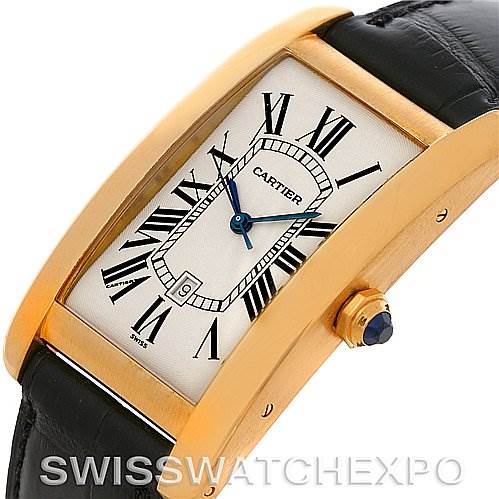 The image shows a side view of a Cartier Tank Americaine W2603156 Men
s Yellow Gold Silver Dial W2603156 Men
s Yellow Gold Silver Dial watch, highlighting its rectangular casing, Roman numeral dial, and crown.