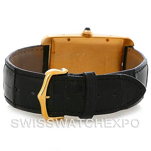 The image shows the back and clasp of a Cartier Tank Americaine W2603156 Men
s Yellow Gold Silver Dial W2603156 Men
s Yellow Gold Silver Dial watch, featuring a gold buckle and black leather strap.