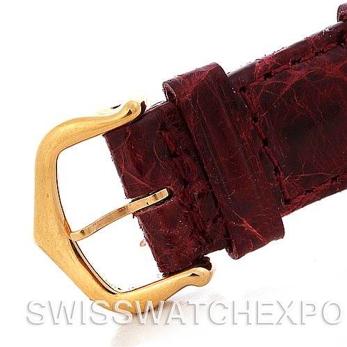 This image shows a close-up of the buckle and leather strap of a Cartier Tank Americaine W2603556 Men's Yellow Gold Silver Dial W2603556 Men's Yellow Gold Silver Dial watch.