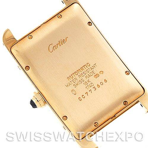 This image shows the back view of a Cartier Tank Américaine watch, highlighting the casing and engravings.