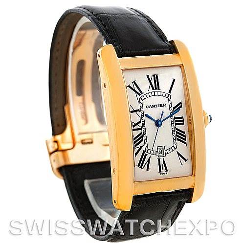 This image showcases a Cartier Tank Americaine W2603156 Men's Yellow Gold Silver Dial W2603156 Men's Yellow Gold Silver Dial watch at a three-quarter angle, highlighting its rectangular dial, gold case, black leather strap, and crown.