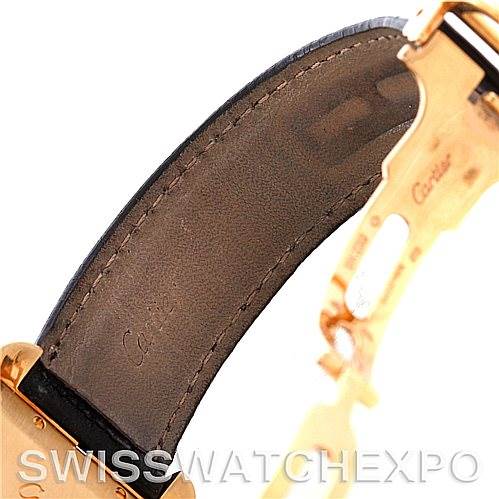 Close-up of the Tank Americaine by Cartier showing the interior of the leather strap and gold clasp.