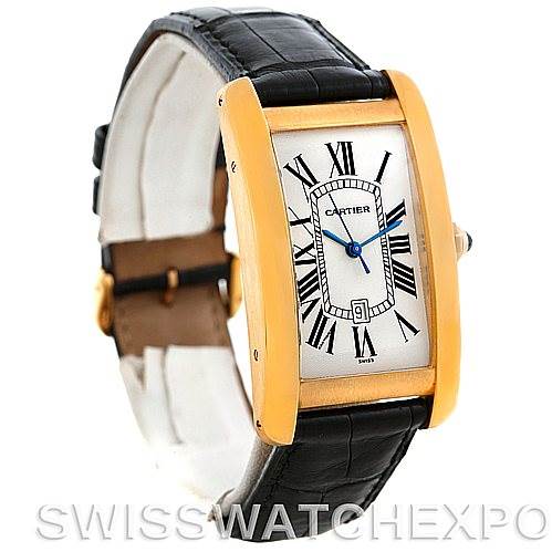 The image shows a Cartier Tank Americaine W2603156 Men
s Yellow Gold Silver Dial W2603156 Men
s Yellow Gold Silver Dial watch with a gold case, black leather strap, and Roman numeral dial from an angled top-front view.