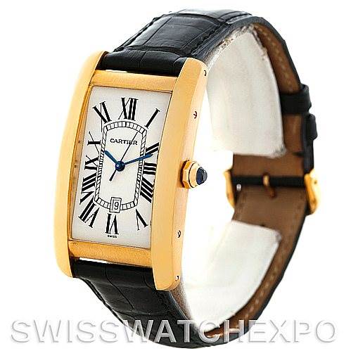 The image shows a side angle view of a Cartier Tank Americaine W2603156 Men
s Yellow Gold Silver Dial W2603156 Men
s Yellow Gold Silver Dial model watch, highlighting the face, crown, and part of the black leather strap.
