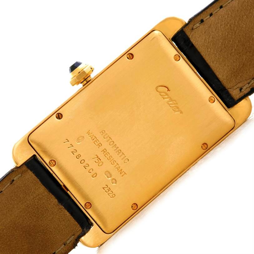 The image shows the back case and strap of a Cartier Tank Américaine watch at a slight angle.