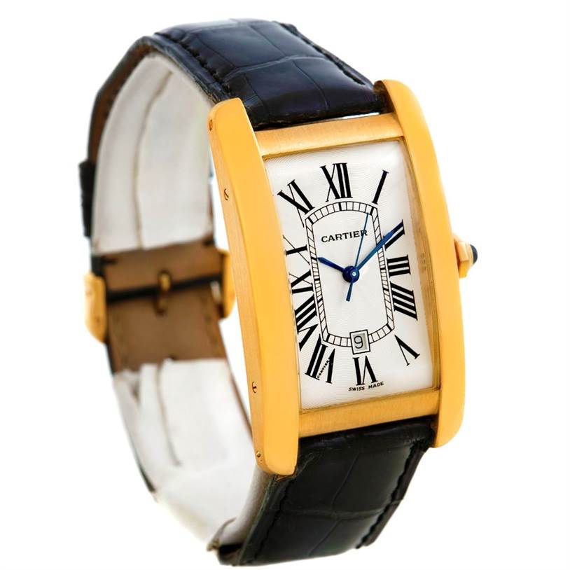 The Cartier Tank Américaine watch is shown at a side angle, revealing its rectangular gold case, white dial with Roman numerals, and black leather strap.
