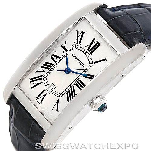 The image shows a top-side view of a Cartier Tank Americaine W2603256 Men's White Gold Silver Dial W2603256 Men's White Gold Silver Dial watch, highlighting the dial, case, crown, and part of the strap.