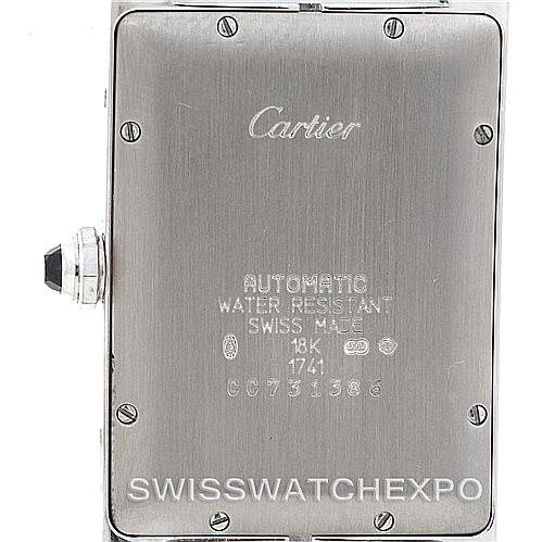 This image shows the back case of the Cartier Tank Américaine watch, highlighting engravings and the crown.