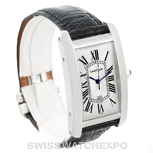 The image shows a Cartier Tank Americaine W2603256 Men's White Gold Silver Dial W2603256 Men's White Gold Silver Dial watch at a slight angle, featuring its rectangular face, Roman numerals, and black leather strap.
