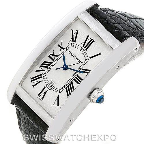 The Cartier Tank Americaine W2603256 Men's White Gold Silver Dial W2603256 Men's White Gold Silver Dial watch is shown at an oblique angle, highlighting its rectangular face, Roman numeral dial, and black leather strap.