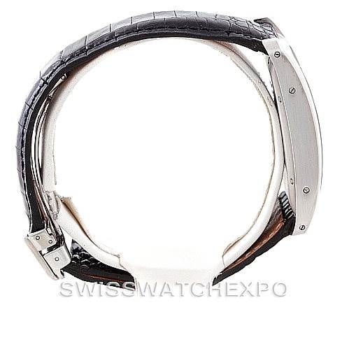 The image shows a side profile of the Tank Américaine model by Cartier, highlighting the watch's case and leather strap.