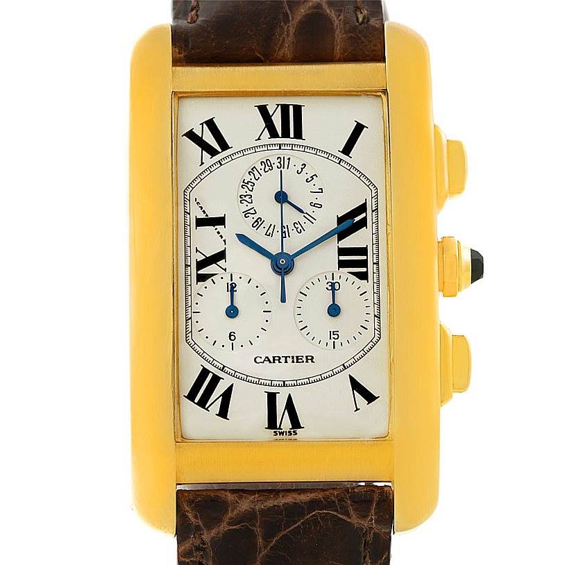 This image shows a Cartier Tank Americaine W2605856 Men's Yellow Gold Silver Dial W2605856 Men's Yellow Gold Silver Dial watch from a front angle, highlighting its rectangular dial and brown leather strap.