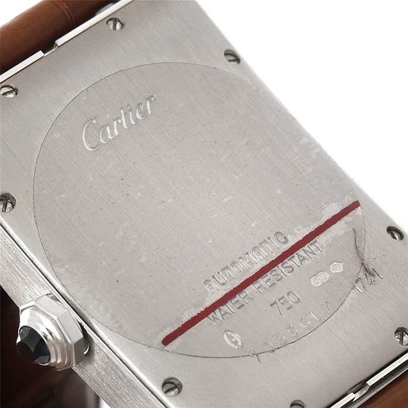 The image shows the back case of a Cartier Tank Americaine W2603256 Men's White Gold Silver Dial W2603256 Men's White Gold Silver Dial watch.