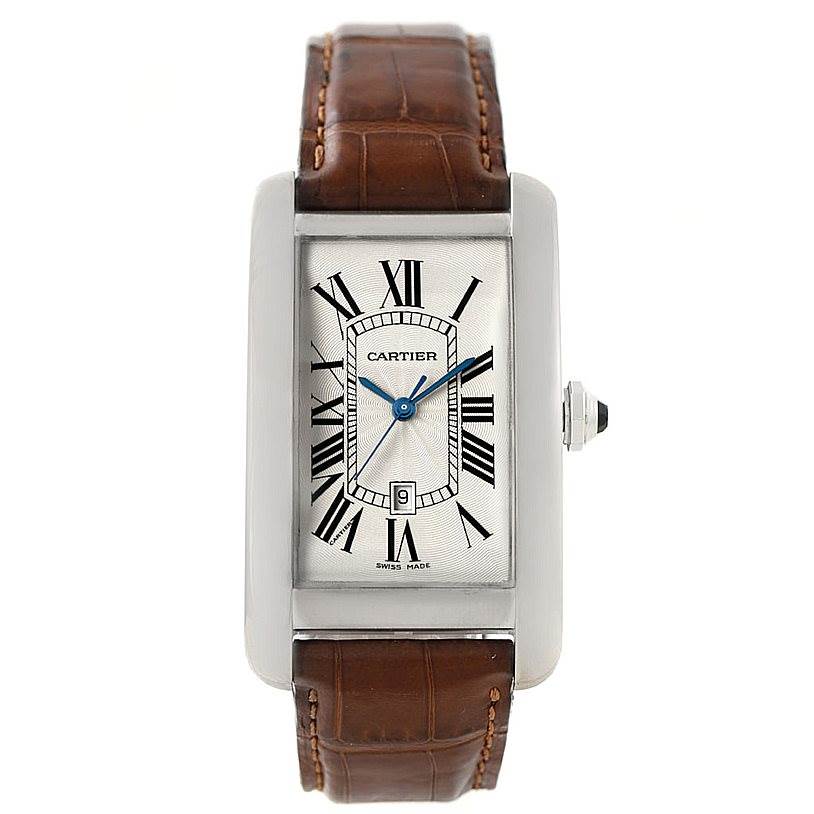 The image shows a front view of the Cartier Tank Americaine W2603256 Men's White Gold Silver Dial W2603256 Men's White Gold Silver Dial watch, highlighting its rectangular face, Roman numerals, and leather strap.