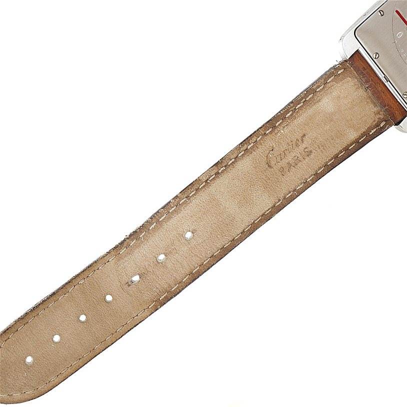 This image shows a close-up of the leather strap and part of the case back of a Cartier Tank Américaine watch.