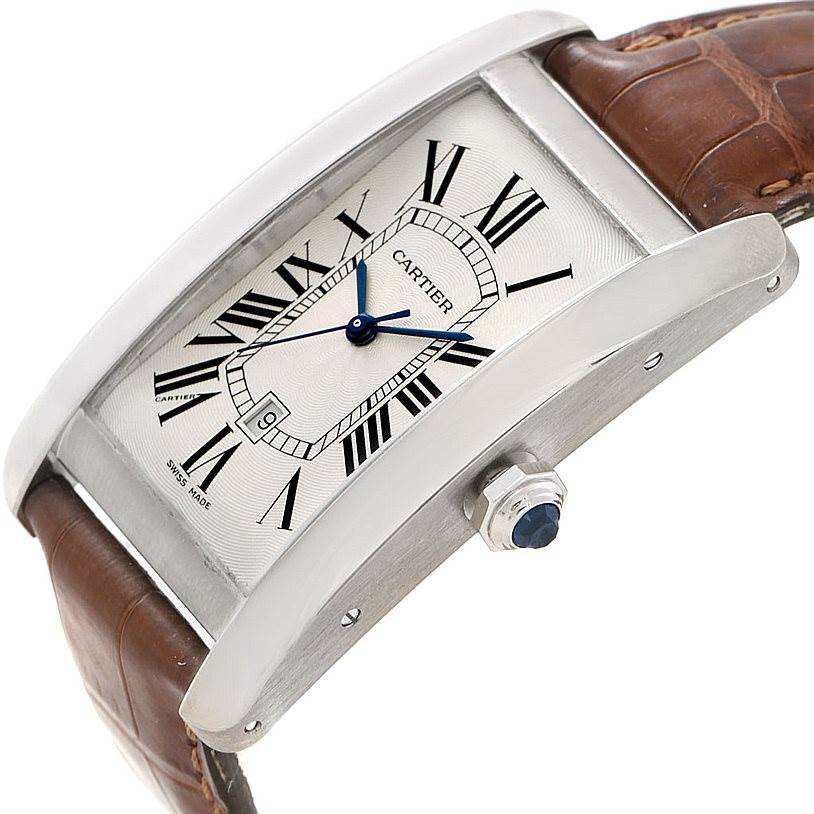 The Tank Americaine by Cartier is shown from a front-side angle, highlighting the face, crown, and leather strap.