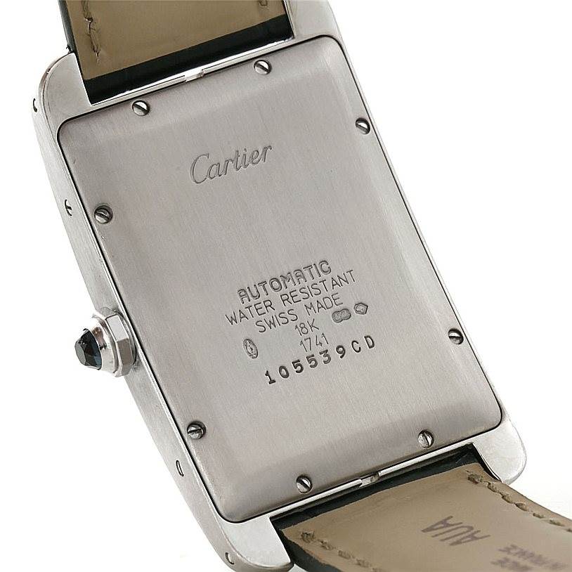 This image shows the back case and buckle of a Cartier Tank Americaine W2603256 Men
s White Gold Silver Dial W2603256 Men
s White Gold Silver Dial watch.