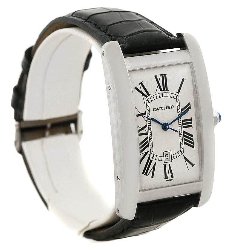 The Cartier Tank Américaine watch is shown at an angled side view, highlighting its rectangular face, Roman numerals, and black leather strap.