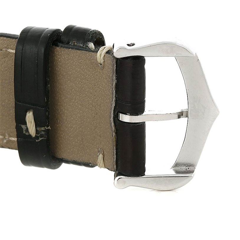 This image shows the clasp and leather strap of the Cartier Tank Américaine watch from a close-up angle.