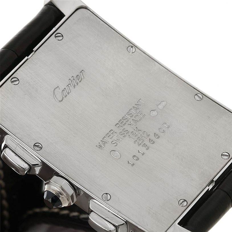 This image shows the back case of the Cartier Tank Americaine W2603358 Men's White Gold Silver Dial W2603358 Men's White Gold Silver Dial watch, highlighting the brand engraving and serial details.